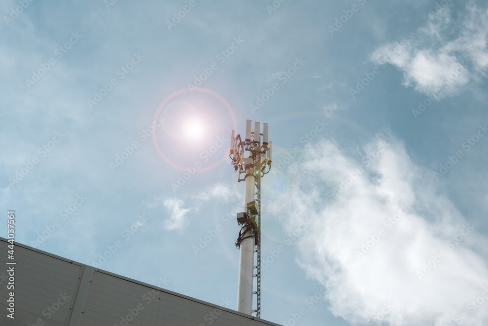 Cell tower. Tower of the fifth generation network. Sun at noon on a clear sky Cell tower. Tower of the fifth generation network. Sun at noon on a clear sky
