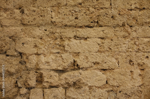 Mur de vieilles pierres jaunes