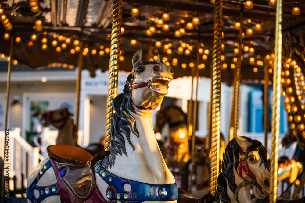 Merry go round rides at the amusement park background