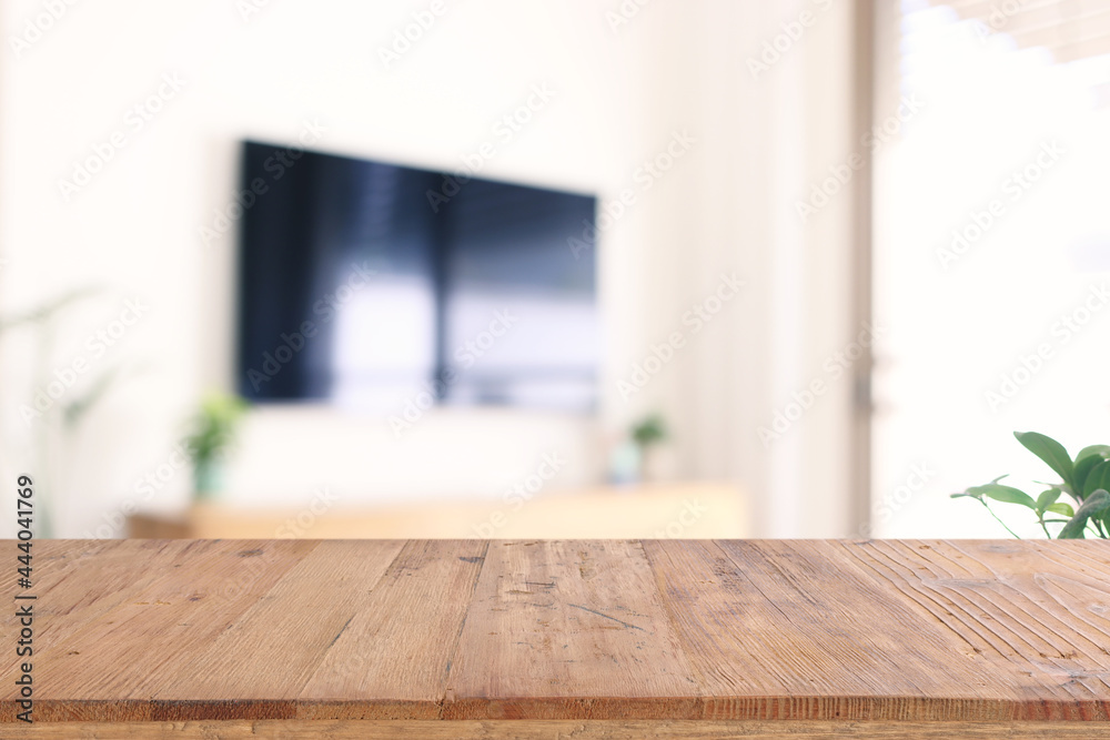 empty table board and defocused indoor background. product display concept