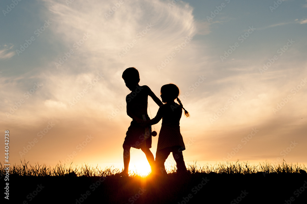 Kids Playing Together in Silhouette 