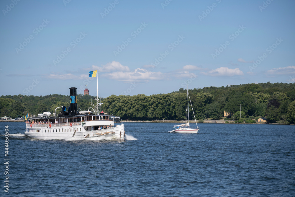 Old commuter steam boat Storskär leaving the Stockholm harbor for the archipelago.