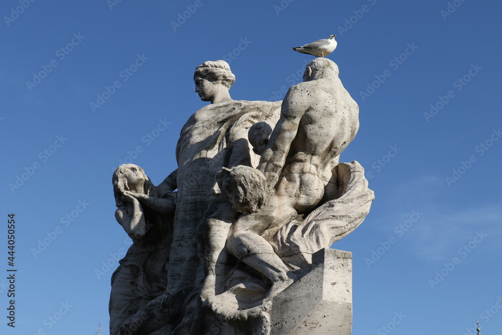 Nature and Arts. Seagull landed on a statue. Rome, Italy.