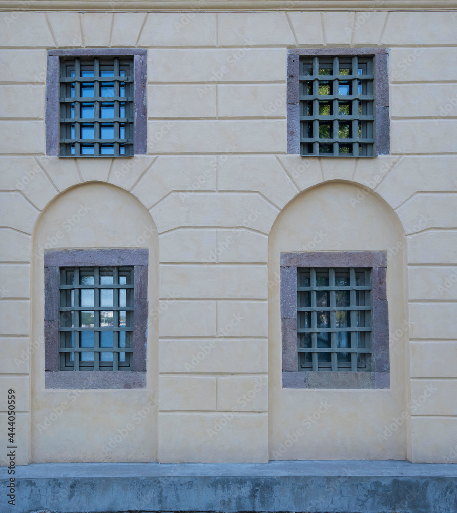 Façade of an old house with windows behind bars in Stockholm Façade of an old house with windows behind bars in Stockholm