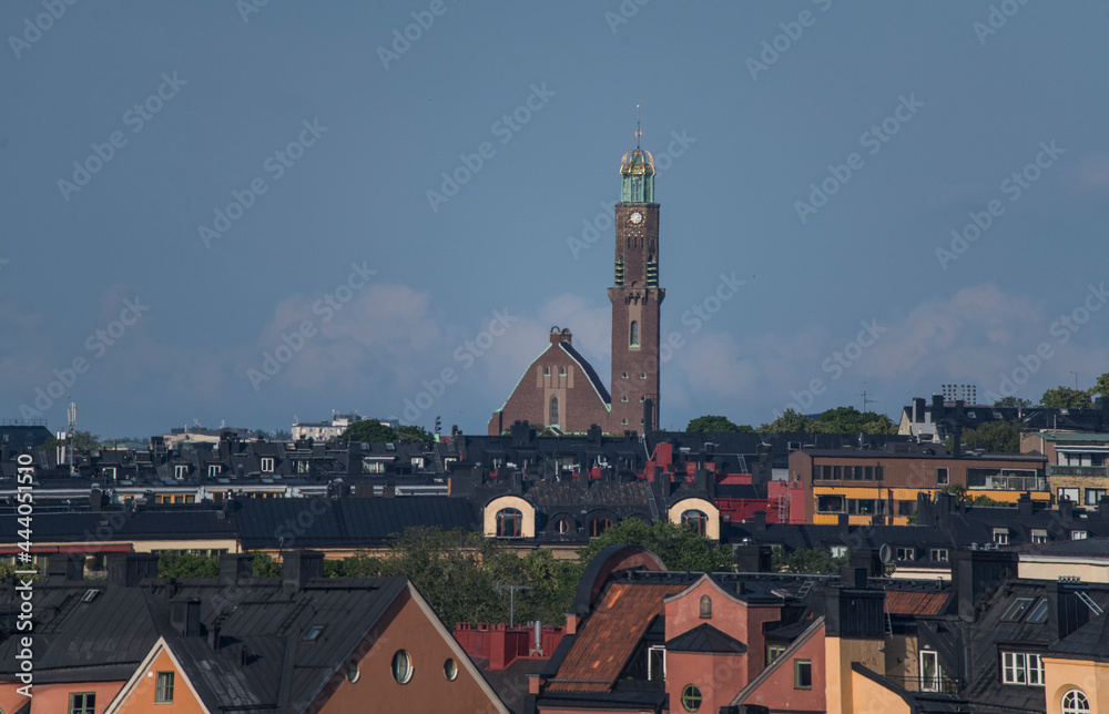 Skyline over the district Vasastan, roofs and the church Engelbrektskyrkan at sunset a summer day