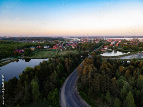 Top view of the road leading to a small town with reservoirs. Photo from the throne. © t.karnash