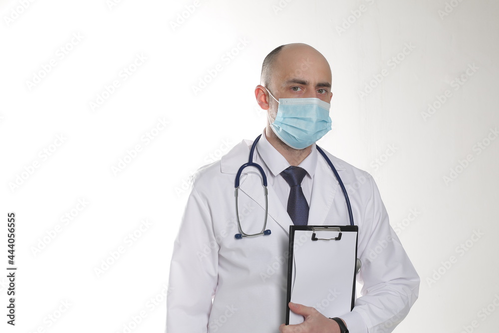 Portrait of professional man in mask with stethoscope, isolated on white background Portrait of professional man in mask with stethoscope, isolated on white background