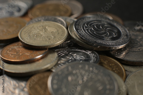 Many coins isolated on a black background