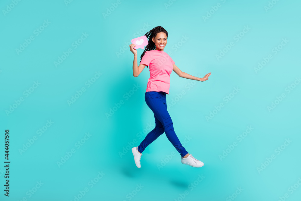 Full body profile photo of sweet brunette hairdo young lady jump hold like wear t-shirt jeans isolated on teal color background