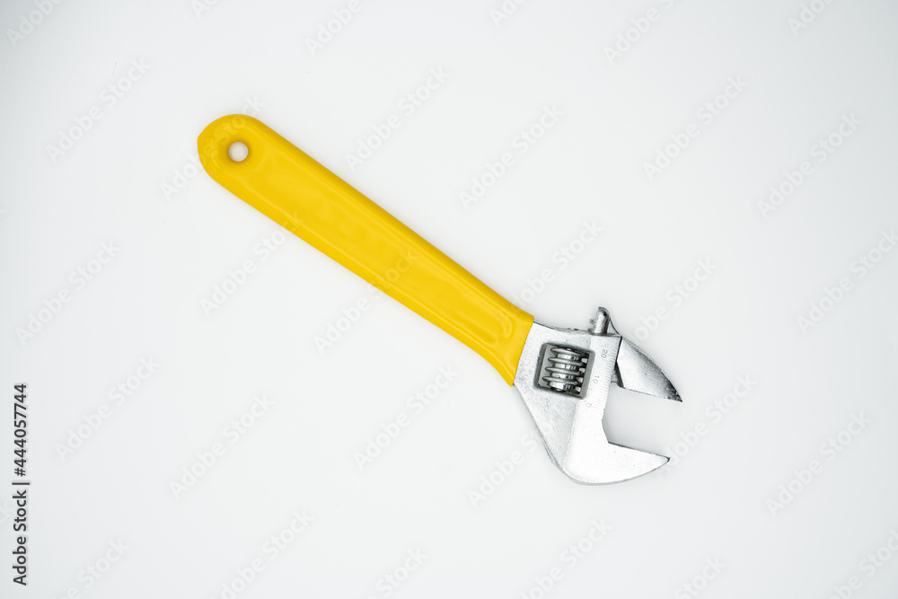 Household tool: monkey spanner with yellow handle Household tool: monkey spanner with yellow handle
