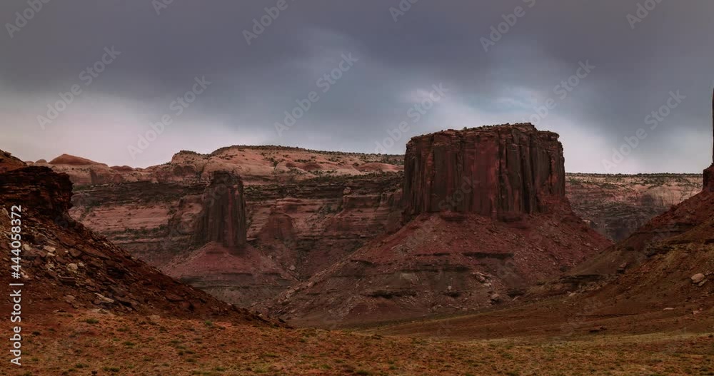 Time lapse of grey clouds over a red desert landscape Time lapse of grey clouds over a red desert landscape