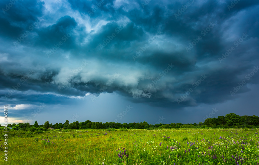 Extreme thunderstorm shelf cloud moving over fields, climate change concept Extreme thunderstorm shelf cloud moving over fields, climate change concept