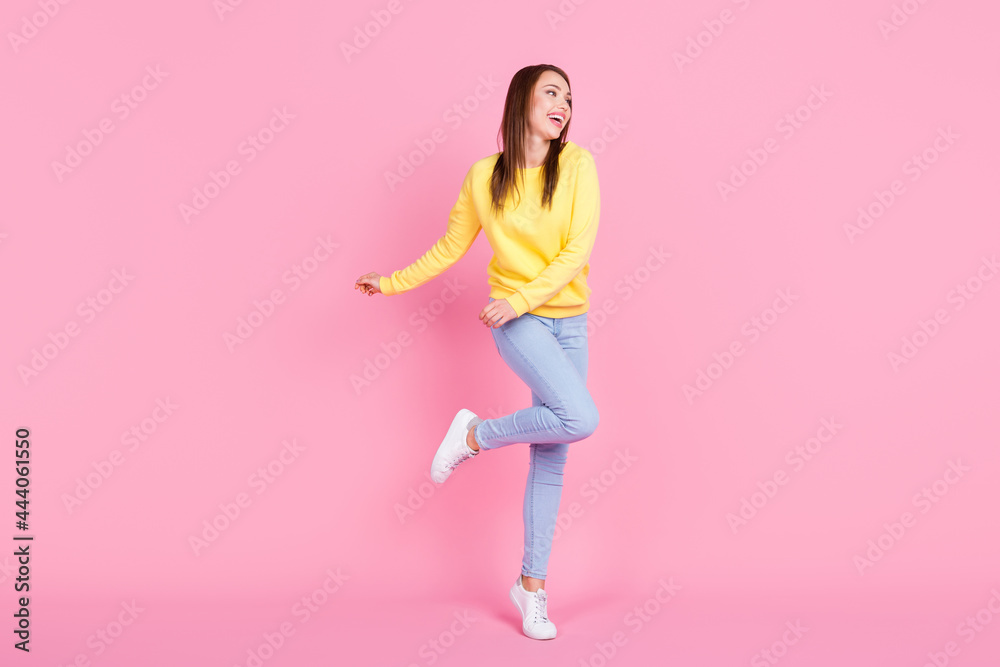 Full length body size view of attractive cheerful girl dancing having fun free time isolated over pastel pink color background