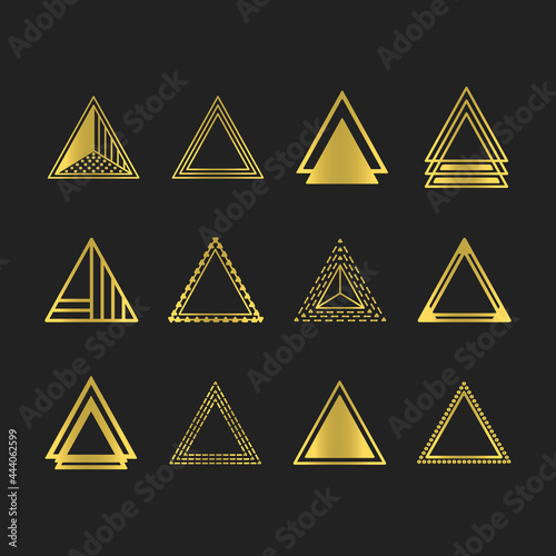 Golden art deco and line equilateral triangles motifs and icons set on black background photo
