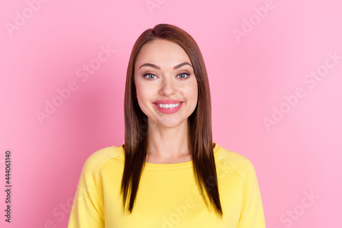 Photo portrait girl wearing yellow clothes smiling cheerful isolated pastel pink color background