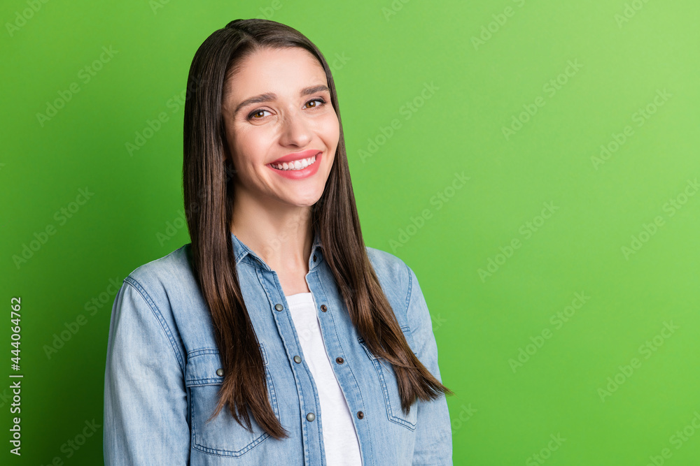 Portrait of attractive cheerful girl copy blank place space ad isolated over bright green color background Portrait of attractive cheerful girl copy blank place space ad isolated over bright green color background