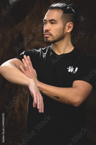 chinese man practicing kung fu in the park