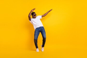 Full length body size view of attractive cheerful guy dancing pout lips having fun isolated over bright yellow color background