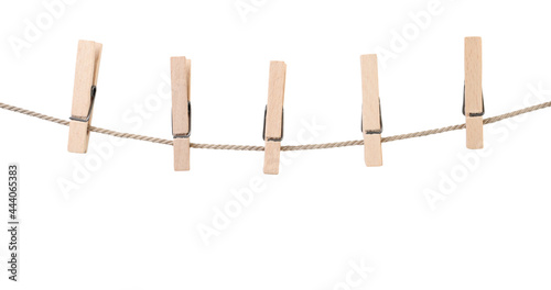 Clothespins on a rope on a white background. Isolated