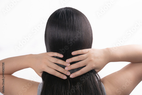 Beautiful young woman after procedure of hair extension in professional salon on white background.hair loss problem and Hair treatment concept