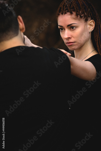 couple practicing kung fu in the park