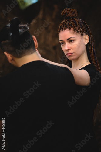 couple practicing kung fu in the park