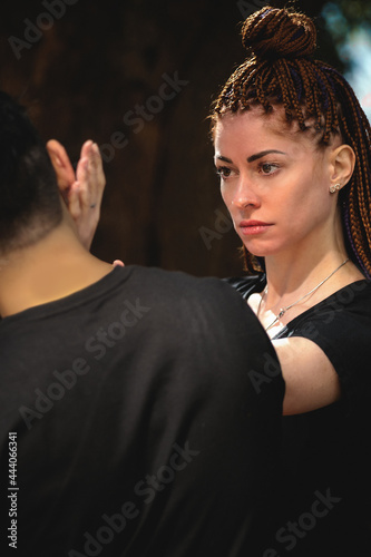 couple practicing kung fu in the park