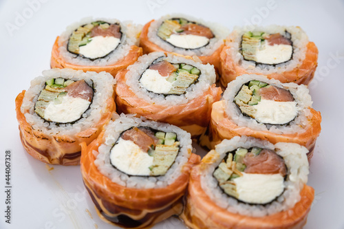 Japanese cuisine. Rolls in plates on a concrete background. with salmon, 