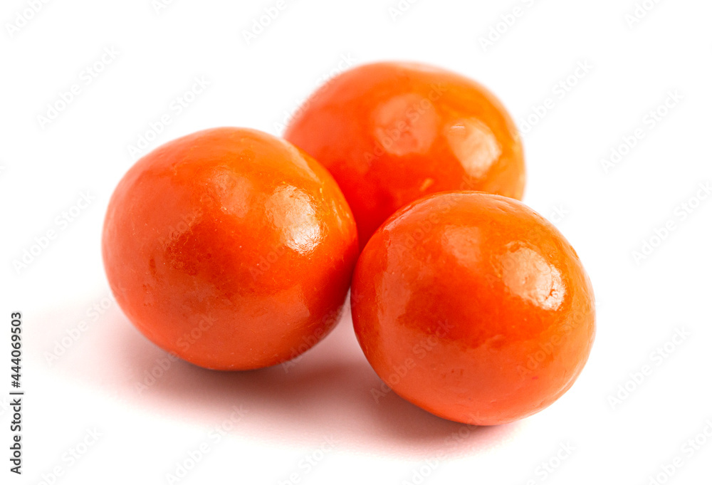 Orange Coated Chocolate Covered Dried Apricot on a White Background Orange Coated Chocolate Covered Dried Apricot on a White Background