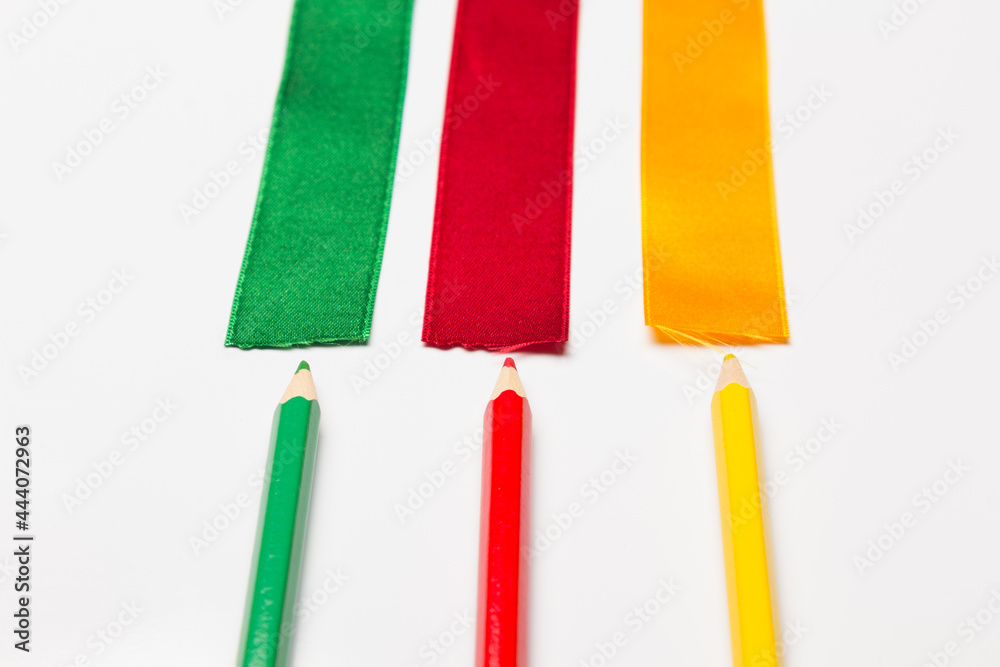 Coloured pencils wrapped in a green ribbon Coloured pencils wrapped in a green ribbon