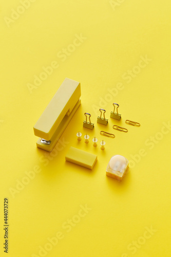 Paper clips, pins, stapler, eraser and sharpener photo