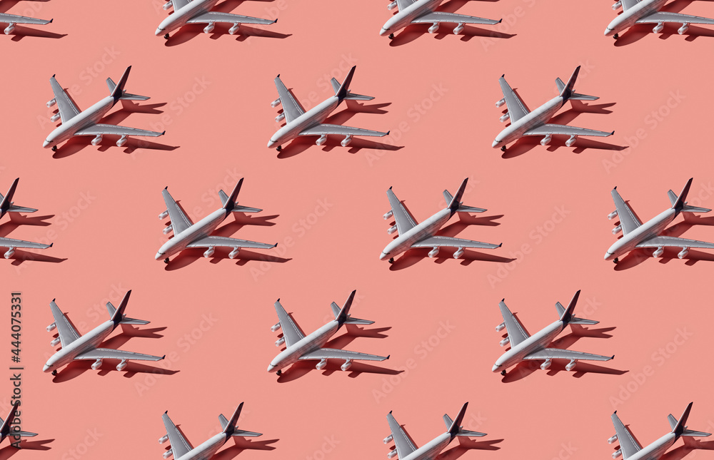 Pattern of plane models on pink pastel background