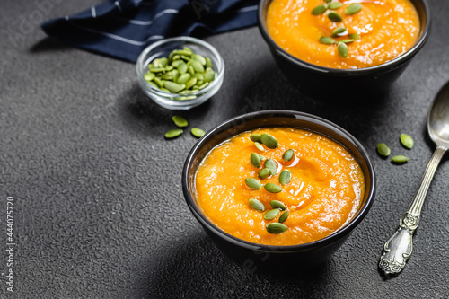 Curried pumpkin soup on dark background.Space for text.