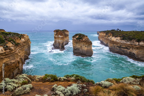 Panoramic view from above on the rocks Loch Ard Gorge, Island Arch and Razorback, Great Ocean Road, Twelve Apostels, Australia in a rocky bay with steep shores but ocean coast.  photo