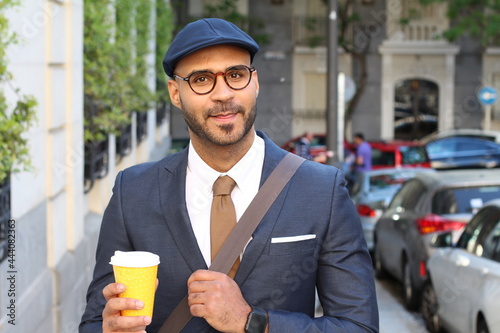 Φωτογραφία Wealthy ethnic entrepreneur walking outdoors