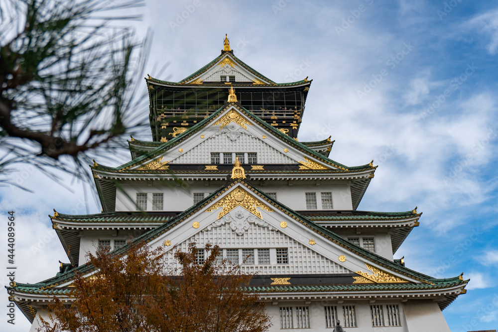 Osaka Castle in Osaka with autumn leaves. Japan.