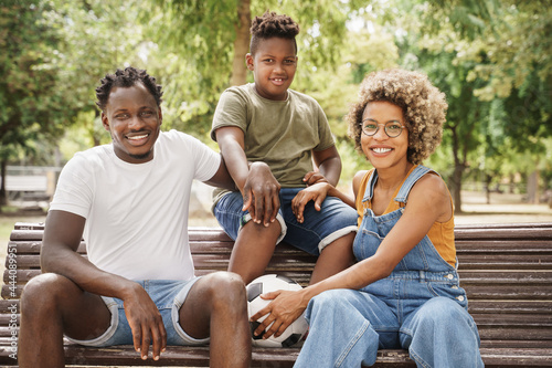 African American family cool millennial parents and kid sitting