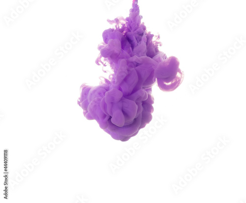 Fototapeta Naklejka Na Ścianę i Meble -  dissolving clouds of purple ink in water on a white background.