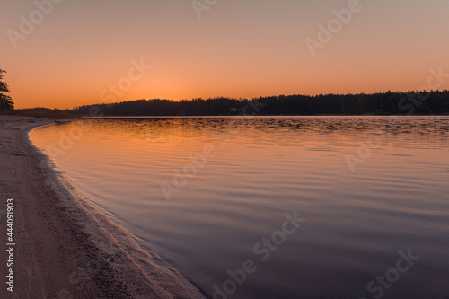 Beautiful sunset over the river. Scandinavian nature. Finland