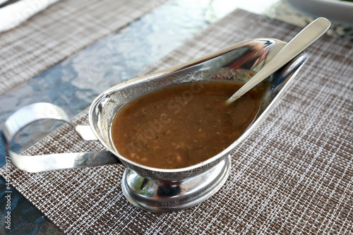 Tkemali sauce in gravy boat