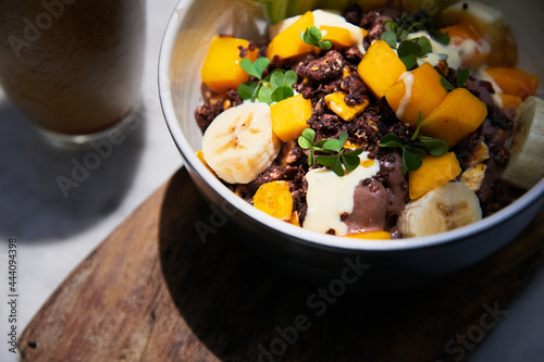 Healthy exotic fruit and frozen cacao breakfast bowl photo