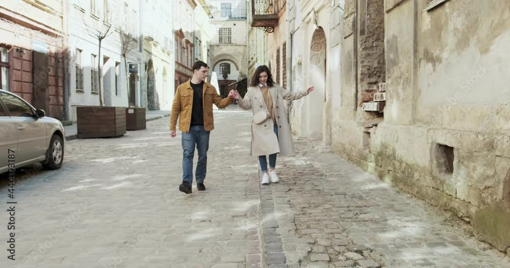 Sweet couple have vacation in old european town. Happy young lovers enjoy time spending together. Walking together in travel Sweet couple have vacation in old european town. Happy young lovers enjoy time spending together. Walking together in travel