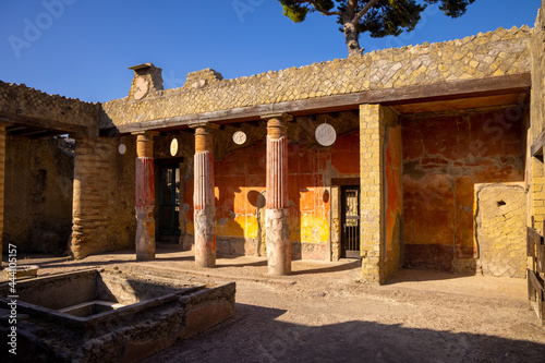 Casa della Gemma in Ercolano with columns. Ruins of ancient roman town Ercolano - Herculaneum, destroyed by the eruption of the Mount Vesuvius, Vesuvio volcano. Historical park of Ercolano, Italy photo