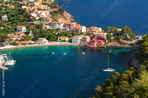 Close up top view at Asos village, Assos peninsula and fantastic turquoise and blue Ionian Sea water. Aerial view, summer scenery of famous and extremely popular travel destination in Cephalonia
