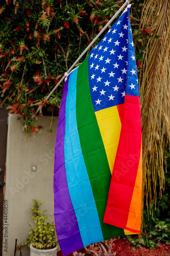 United States rainbow Pride flag flies outside home photo