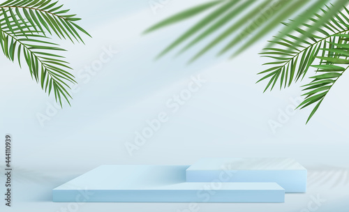 Abstract minimalistic background with a set of square pedestals in blue tones. Empty podiums for product display with tropical palm leaf decorations.