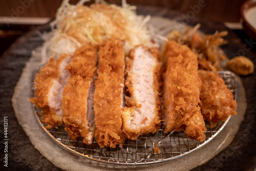 Selected focus at Tonkutsu menu, Japanese deep fried port serve with rice and Miso soup, on table in Japanese restaurant.  photo