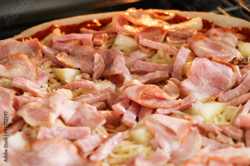 Homemade pizza topped with bacon and delicious.