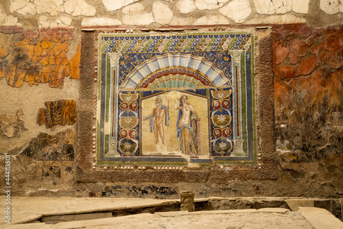 A Roman mosaic on a wall in the House of Neptune and Amphitrite. Ruins of ancient roman town Ercolano - Herculaneum, destroyed by the eruption of the Mount Vesuvius, Vesuvio volcano. Italy photo