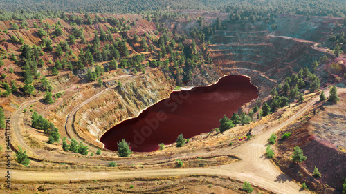 Acidic red lake in open pit of abandoned Kokkinopezoula copper mine in Mitsero, Cyprus